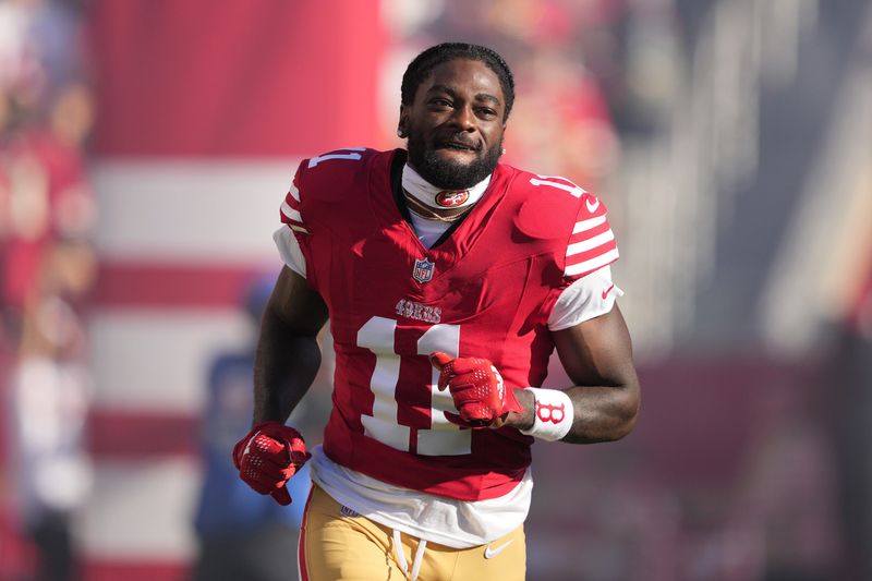 Sep 9, 2024; Santa Clara, California, USA; San Francisco 49ers wide receiver Brandon Aiyuk (11) is introduced to the crowd before the game against the New York Jets at Levi's Stadium. Mandatory Credit: Darren Yamashita-Imagn Images