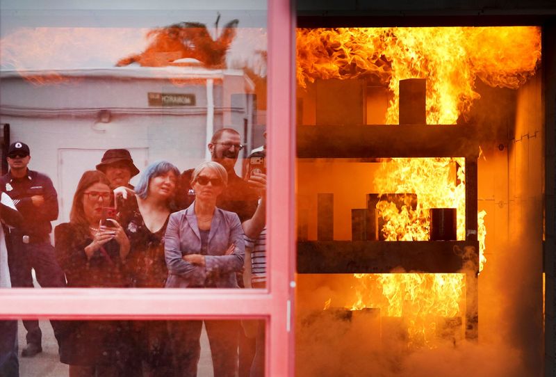 A large group tours the Ventura County Fire Department’s $32.5 million live-fire training facility on June 24. In this demonstration, the scenario simulates a kitchen fire at a strip mall.