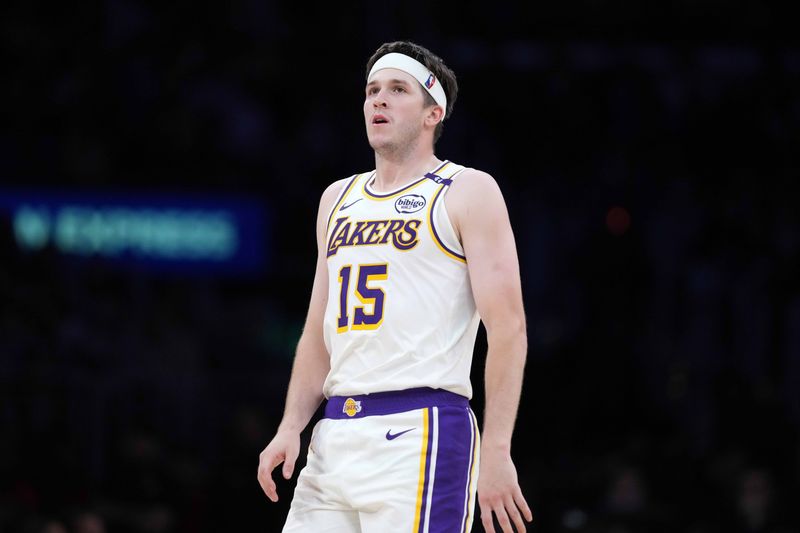 Mar 16, 2025; Los Angeles, California, USA; Los Angeles Lakers guard Austin Reaves (15) reacts against the Phoenix Suns in the second half at Crypto.com Arena. Mandatory Credit: Kirby Lee-Imagn Images