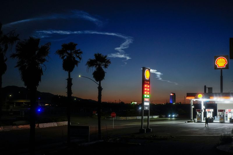 The contrails from the SpaceX Falcon 9 rocket, right, linger in the atmosphere as seen from Cabazon, Calif., June 24, 2026.