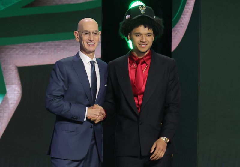 Jun 23, 2026; New York, NY, USA; NBA commissioner Adam Silver greets the tenth pick in the 2026 NBA draft, Arizona guard Brayden Burries after he was selected by the Milwaukee Bucks at Barclays Center. Mandatory Credit: Brad Penner-Imagn Images