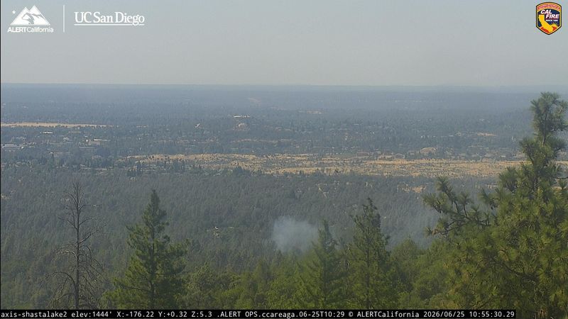 Smoke rises from what firefighters said was an illegal debris burn off Quartz Hill Road in west Redding on Thursday, June 25, 2026.