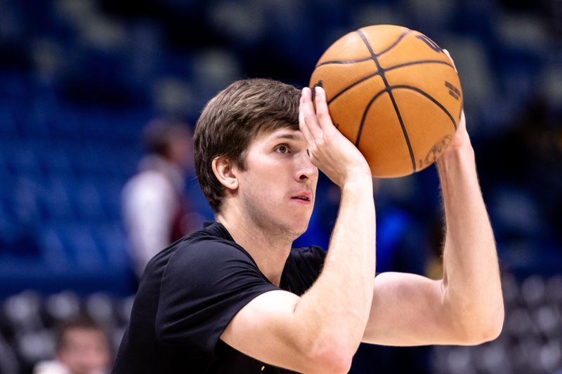 Nov 16, 2024; New Orleans, Louisiana, USA;  Los Angeles Lakers guard Austin Reaves (15) during warmups before the game against the New Orleans Pelicans at Smoothie King Center. Mandatory Credit: Stephen Lew-Imagn Images
