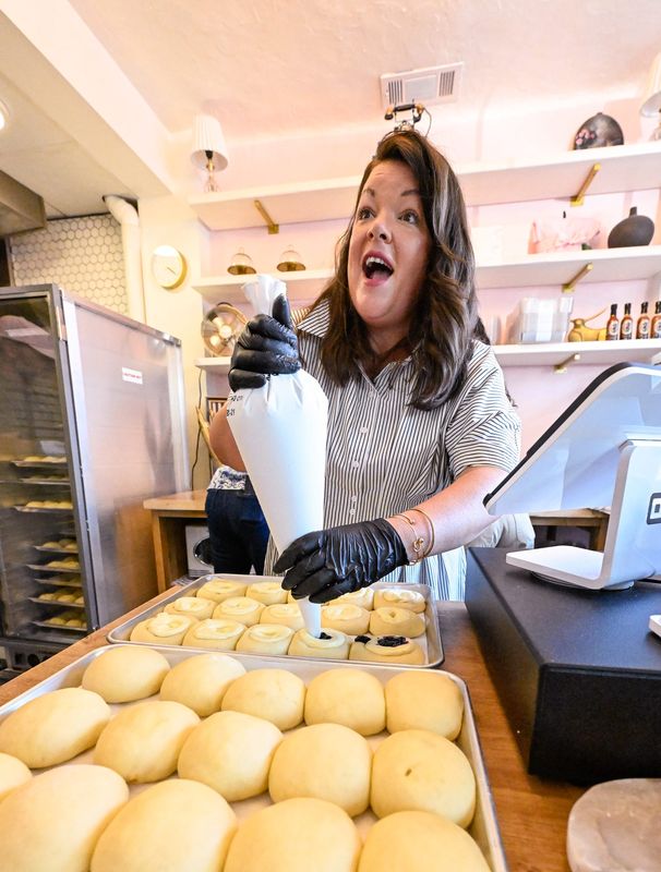 Crystal Smith prepares kolaches Thursday, June 25, 2026 during the grand opening for Stuffed Buns next to the Fox Theater A variety of kolaches are available 7 a.m. to 1 p.m. Monday through Saturday.