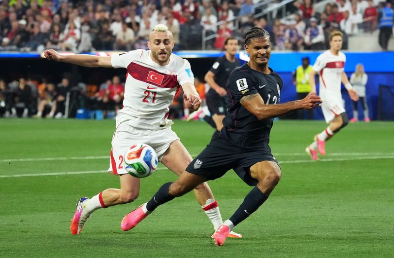 U.S. Men's National Team player Miles Robinson of Arlington, Massachusetts, in action with Turkey's Baris Alper Yilmaz during the June 25, 2026 FIFA World Cup match in Inglewood, California. Turkey won the group round match 3-2, but the U.S. men's national team has already locked in the top spot in the group and are moving on to the Round of 32.