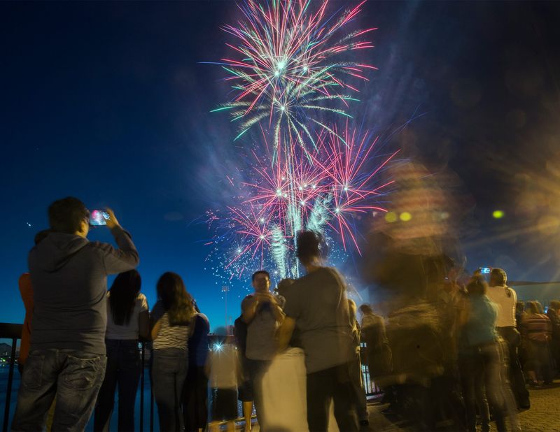 Spectators watch the annual 4th of July fireworks show from the Weber Point Events Center in downtown Stockton on Jul. 4, 2018.