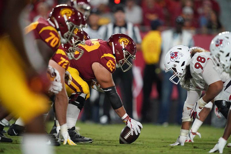 Aug 31, 2019; Los Angeles, CA, USA; General overall view as Southern California Trojans center Brett Neilon (62) snaps the ball against Fresno State Bulldogs defensive tackle Keiti Iakopo (98) at the line of scrimmage uat Los Angeles Memorial Coliseum. USC defeated Fresno State 31-23.  Mandatory Credit: Kirby Lee-USA TODAY Sports