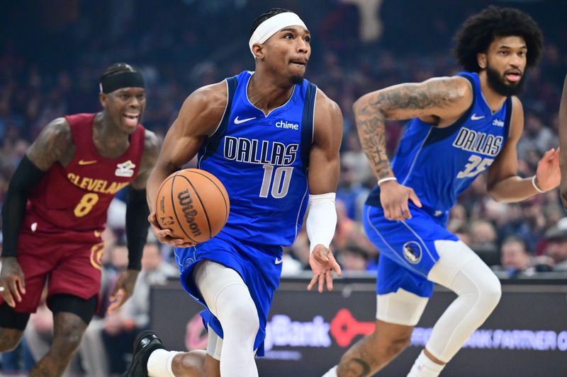 Mar 15, 2026; Cleveland, Ohio, USA; Dallas Mavericks guard Brandon Williams (10) brings the ball up court against the Cleveland Cavaliers during the first half at Rocket Arena. Mandatory Credit: Ken Blaze-Imagn Images