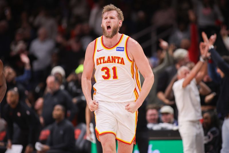 Feb 5, 2026; Atlanta, Georgia, USA; Atlanta Hawks center Jock Landale (31) reacts after a basket against the Utah Jazz in the fourth quarter at State Farm Arena. Mandatory Credit: Brett Davis-Imagn Images