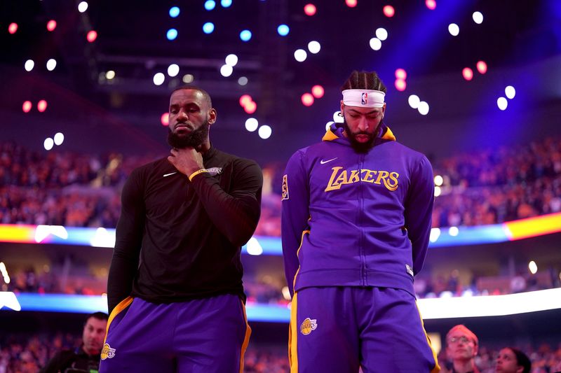 May 2, 2023; San Francisco, California, USA; Los Angeles Lakers forward LeBron James (6) stands next to forward Anthony Davis (3) during the playing of the national anthem before game one of the 2023 NBA playoffs against the Golden State Warriors at the Chase Center. Mandatory Credit: Cary Edmondson-USA TODAY Sports