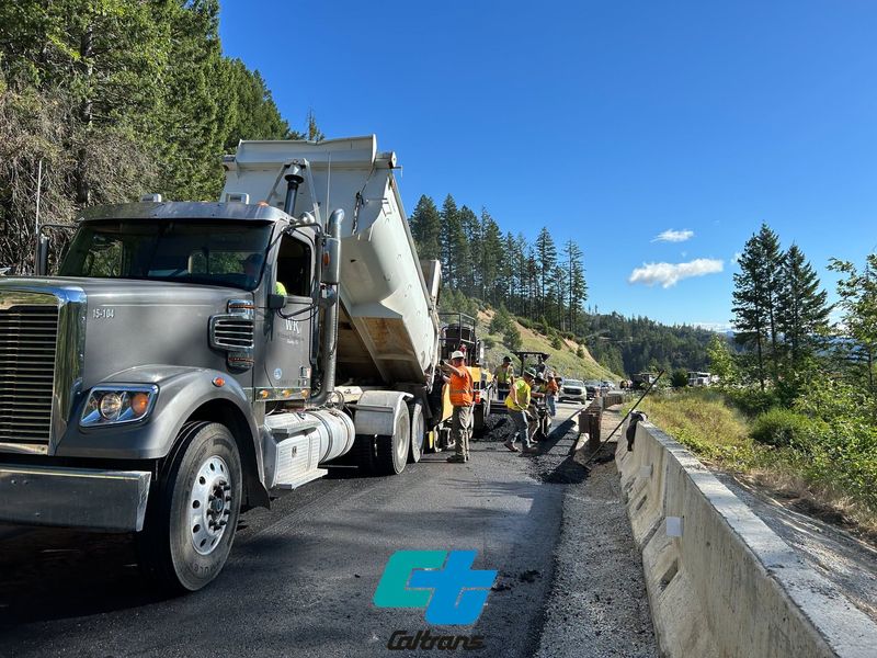 A line of waiting traffic is visible as Caltrans crews rebuild part of the eastbound lane and shoulder of Highway 299 west of Redding near Buckhorn Summit. Heavy winter storms damaged the cliff side of the highway, the state said in March.