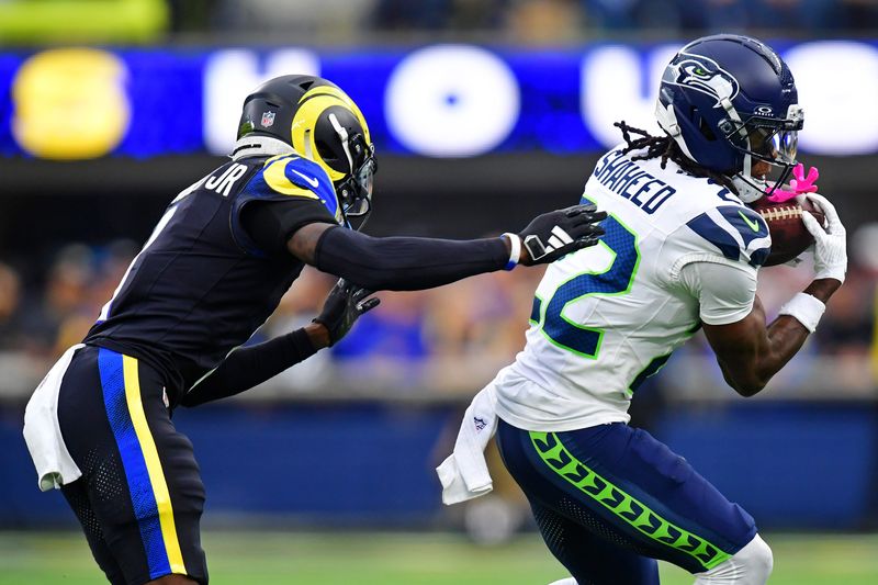 Nov 16, 2025; Inglewood, California, USA; Seattle Seahawks wide receiver Rashid Shaheed (22) makes a catch against Los Angeles Rams cornerback Emmanuel Forbes Jr. (1) during the second half at SoFi Stadium. Mandatory Credit: Gary A. Vasquez-Imagn Images