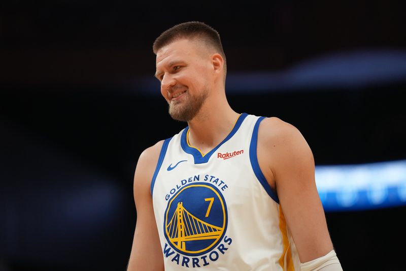 Apr 5, 2026; San Francisco, California, USA; Golden State Warriors forward Kristaps Porzingis (7) smiles during a break in the action against the Houston Rockets in the second quarter at the Chase Center. Mandatory Credit: Cary Edmondson-Imagn Images