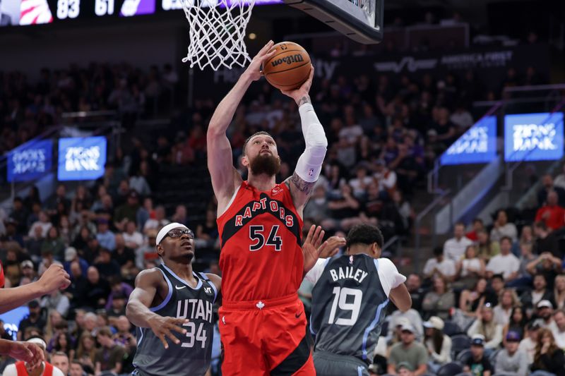 Mar 23, 2026; Salt Lake City, Utah, USA;  Toronto Raptors forward/center Sandro Mamukelashvili (54) shoots the ball during the second half against the Utah Jazz at Delta Center. Mandatory Credit: Chris Nicoll-Imagn Images