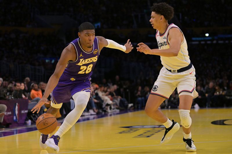 Nov 25, 2025; Los Angeles, California, USA;  Los Angeles Lakers forward Rui Hachimura (28) is defended by Los Angeles Clippers guard Kobe Sanders (4) during the first half at Crypto.com Arena. Mandatory Credit: Jayne Kamin-Oncea-Imagn Images