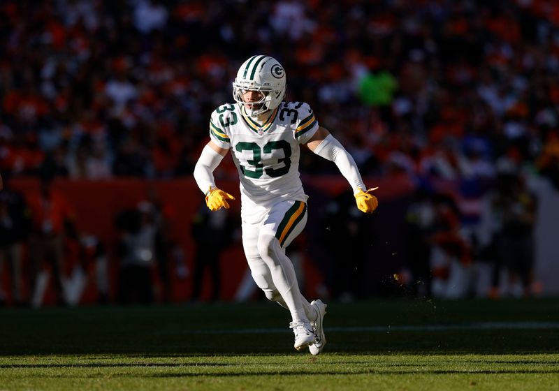 Dec 14, 2025; Denver, Colorado, USA; Green Bay Packers safety Evan Williams (33) runs downfield during the second quarter against the Denver Broncos at Empower Field at Mile High. Mandatory Credit: Isaiah J. Downing-Imagn Images