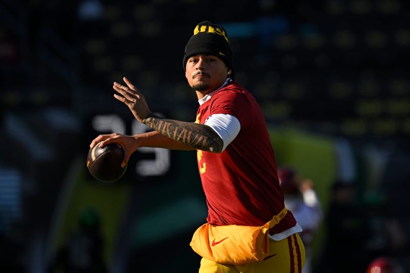 Nov 22, 2025; Eugene, Oregon, USA; Southern California Trojans quarterback Jayden Maiava (14) warms up before the game against the Oregon Ducks at Autzen Stadium. Mandatory Credit: Troy Wayrynen-Imagn Images