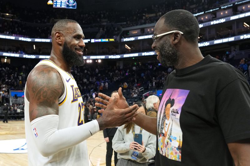Jan 25, 2025; San Francisco, California, USA; Los Angeles Lakers forward LeBron James (left) talks with Golden State Warriors forward Draymond Green (right) after the game at Chase Center. Mandatory Credit: Darren Yamashita-Imagn Images