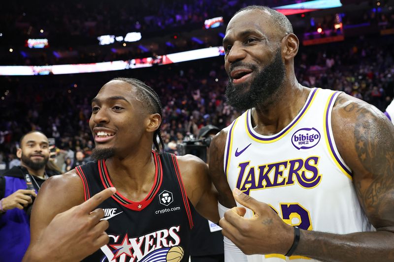 Dec 7, 2025; Philadelphia, Pennsylvania, USA; Los Angeles Lakers forward Lebron James (23) and Philadelphia 76ers guard Tyrese Maxey after the game at Xfinity Mobile Arena. Mandatory Credit: Bill Streicher-Imagn Images