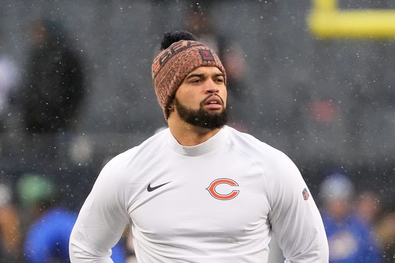 Jan 18, 2026; Chicago, IL, USA; Chicago Bears quarterback Caleb Williams (18) looks on during warmups before an NFC Divisional Round game against the Los Angeles Rams at Soldier Field. Mandatory Credit: David Banks-Imagn Images