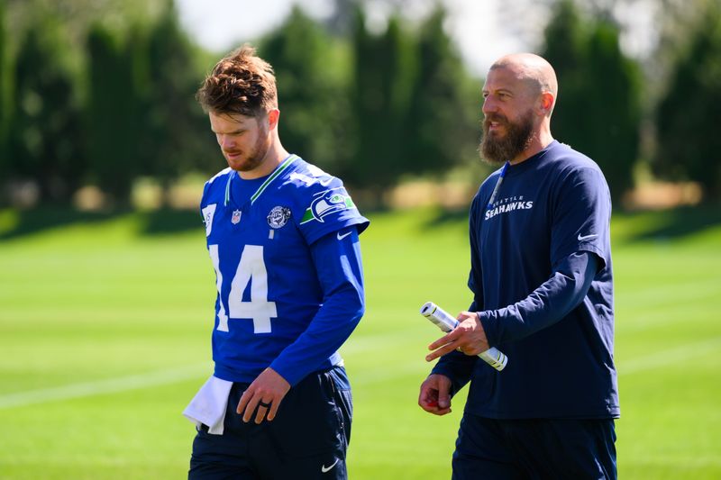 Jun 9, 2026; Renton, WA, USA; Seattle Seahawks quarterback Sam Darnold (14) and offensive coordinator Brian Fleury during minicamp at Virginia Mason Athletic Center. Mandatory Credit: Steven Bisig-Imagn Images