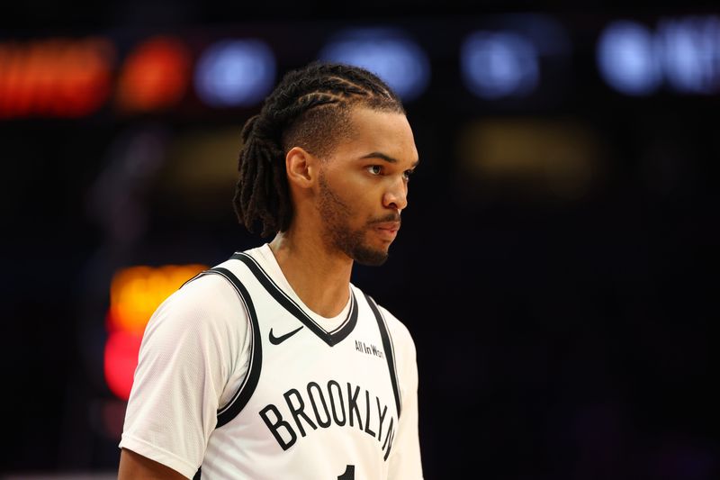 Jan 27, 2026; Phoenix, Arizona, USA; Brooklyn Nets forward Ziaire Williams (1) against the Phoenix Suns at Mortgage Matchup Center. Mandatory Credit: Mark J. Rebilas-Imagn Images