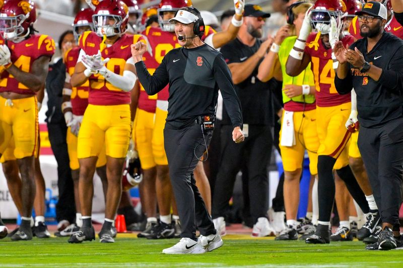 Oct 11, 2025; Los Angeles, California, USA;  USC Trojans head coach Lincoln Riley celebrates after kicker Ryon Sayeri (48) hit a 54-yard field goal in the second half against the Michigan Wolverines at United Airlines Field at the Los Angeles Memorial Coliseum. Mandatory Credit: Jayne Kamin-Oncea-Imagn Images