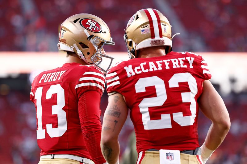 Nov 24, 2025; Santa Clara, California, USA; San Francisco 49ers quarterback Brock Purdy (13) and running back Christian McCaffrey (23) practice before the game against the Carolina Panthers at Levi's Stadium. Mandatory Credit: Kelley L Cox-Imagn Images