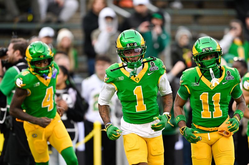 Dec 20, 2025; Eugene, OR, USA; Oregon Ducks wide receiver Dakorien Moore (1) looks on before the game against the James Madison Dukes at Autzen Stadium. Mandatory Credit: Troy Wayrynen-Imagn Images