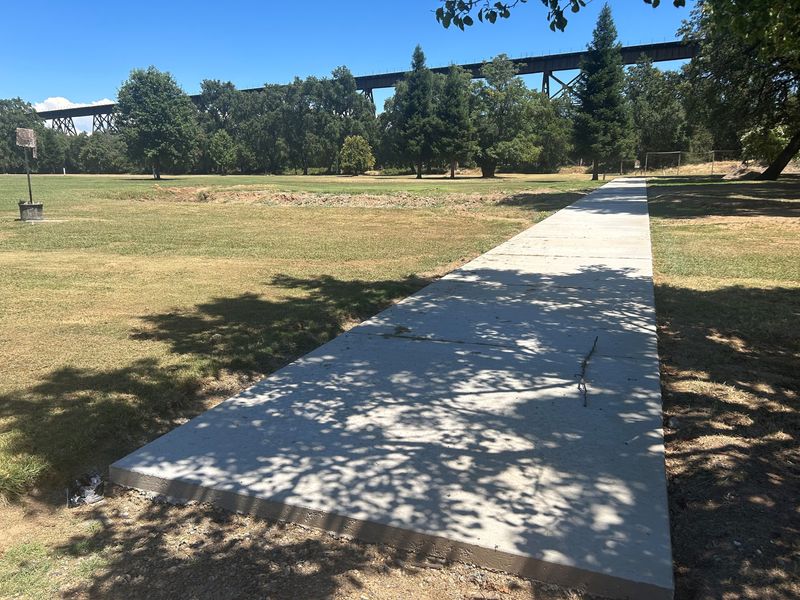 The concrete pad that will house the driving-range bays at The Range at Lake Redding, formerly Lake Redding Golf Course, on Tuesday, July 14, 2026.