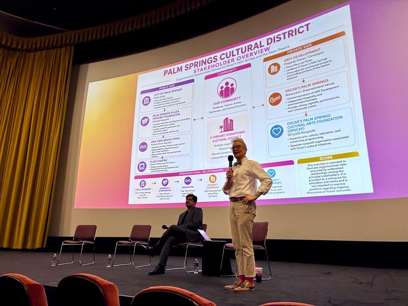 Moderator Kristen Carroll speaks on stage at the Palm Springs Cultural Center, with Oscar's owner Dan Gore, the evening of Wednesday, July 15.