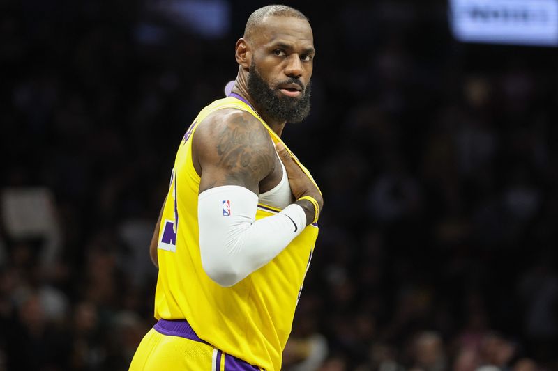 Feb 3, 2026; Brooklyn, New York, USA;  Los Angeles Lakers forward LeBron James (23) checks back into the game in the first quarter against the Brooklyn Nets at Barclays Center. Mandatory Credit: Wendell Cruz-Imagn Images