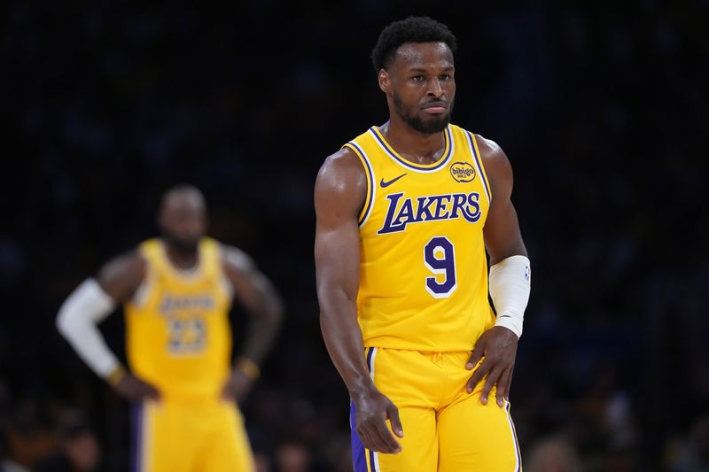Apr 18, 2026; Los Angeles, California, USA; Los Angeles Lakers guard Bronny James (9) and father LeBron James (23) react in the first half against the Houston Rockets during game one of the first round of the 2026 NBA Playoffs at Crypto.com Arena. Mandatory Credit: Kirby Lee-Imagn Images