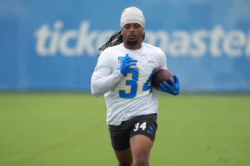 May 11, 2026; El Segundo, CA, USA; Los Angeles Chargers running back Keaton Mitchell (34) carries the ball during offseason workouts at The Bolt. Mandatory Credit: Kirby Lee-Imagn Images