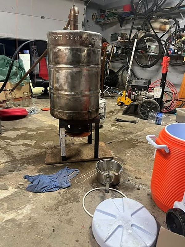 Anderson police arrested a Shasta County man on probation after they found a moonshine still and open flame burning in his garage on July 22, 2026.