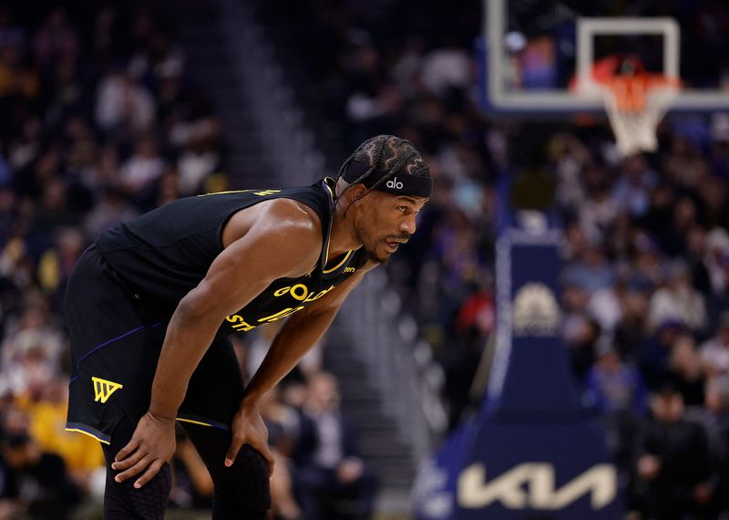 Jan 19, 2026; San Francisco, California, USA; Golden State Warriors forward Jimmy Butler III (10) between plays against the Miami Heat during the first quarter at Chase Center. Mandatory Credit: Kelley L Cox-Imagn Images