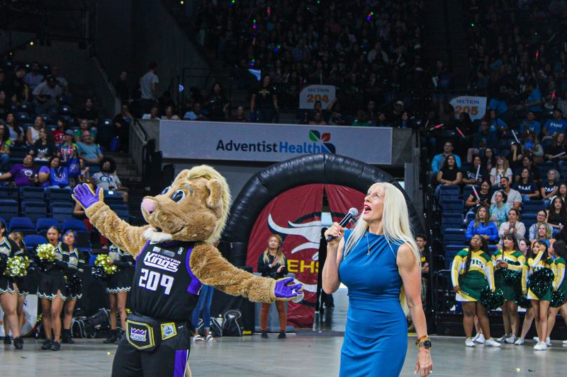 Stockton Unified School District Superintendent Michelle Rodriguez and the Stockton Kings mascot, Dunkson, react during a competition at the district's fourth annual staff kickoff event at Adventist Health Arena in Stockton on July 27, 2026.