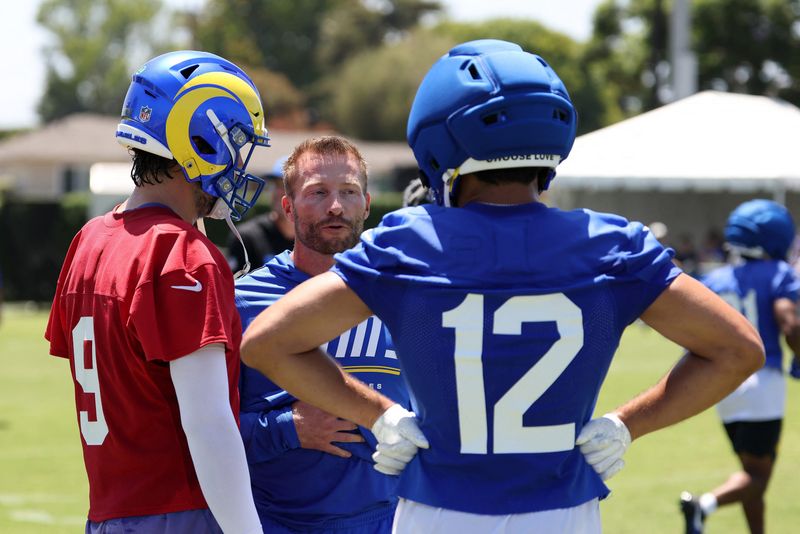Jul 29, 2026; Los Angeles, CA, USA;  Los Angeles Rams  head coach Sean McVay talks to quarterback Matthew Stafford (9) and wide receiver Puka Nacua (12) during training camp at Loyola Marymount University. Mandatory Credit: Kiyoshi Mio-Imagn Images