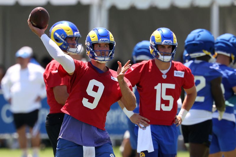 Jul 29, 2026; Los Angeles, CA, USA;  Los Angeles Rams quarterback Matthew Stafford (9) throws a pass as quarterback Ty Simpson (15) watches during training camp at Loyola Marymount University. Mandatory Credit: Kiyoshi Mio-Imagn Images