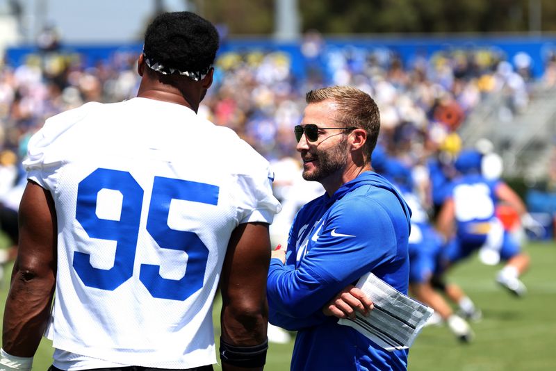 Jul 29, 2026; Los Angeles, CA, USA;  Los Angeles Rams  head coach Sean McVay talks to defensive end Garrett Myles (95) during training camp at Loyola Marymount University. Mandatory Credit: Kiyoshi Mio-Imagn Images