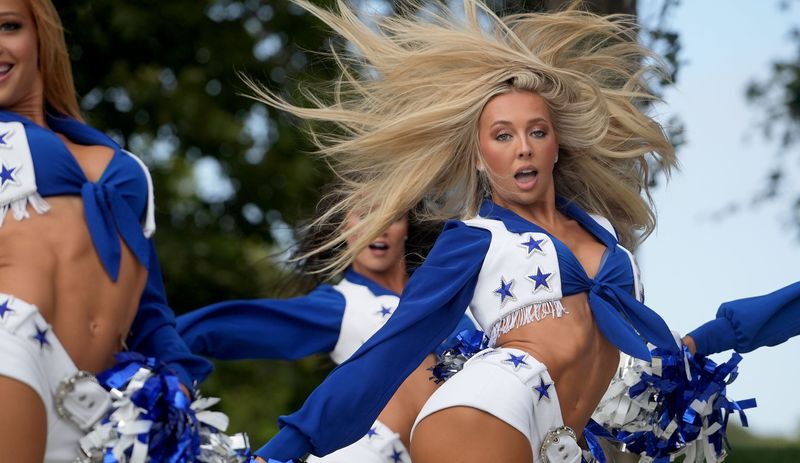Dallas Cowboys Cheerleaders perform at The Collection at RiverPark in Oxnard on Friday during Fan Night July 31, 2026. Hundreds of Dallas Cowboys fans filled the mall's lawn for the festivities.