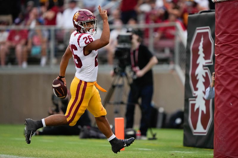 Sep 10, 2022; Stanford, California, USA;  USC Trojans running back Travis Dye (26) celebrates after scoring a touchdown during the second quarter against the Stanford Cardinal at Stanford Stadium. Mandatory Credit: Stan Szeto-USA TODAY Sports