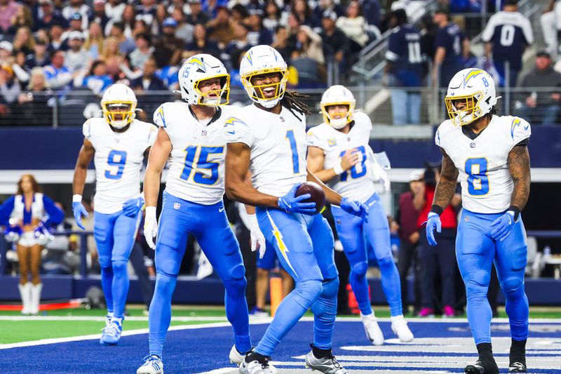 Dec 21, 2025; Arlington, Texas, USA; Los Angeles Chargers wide receiver Quentin Johnston (1) celebrates with wide receiver Ladd McConkey (15) and running back Omarion Hampton (8) after catching a touchdown pass against the Dallas Cowboys during the first quarter at AT&T Stadium. Mandatory Credit: Kevin Jairaj-Imagn Images