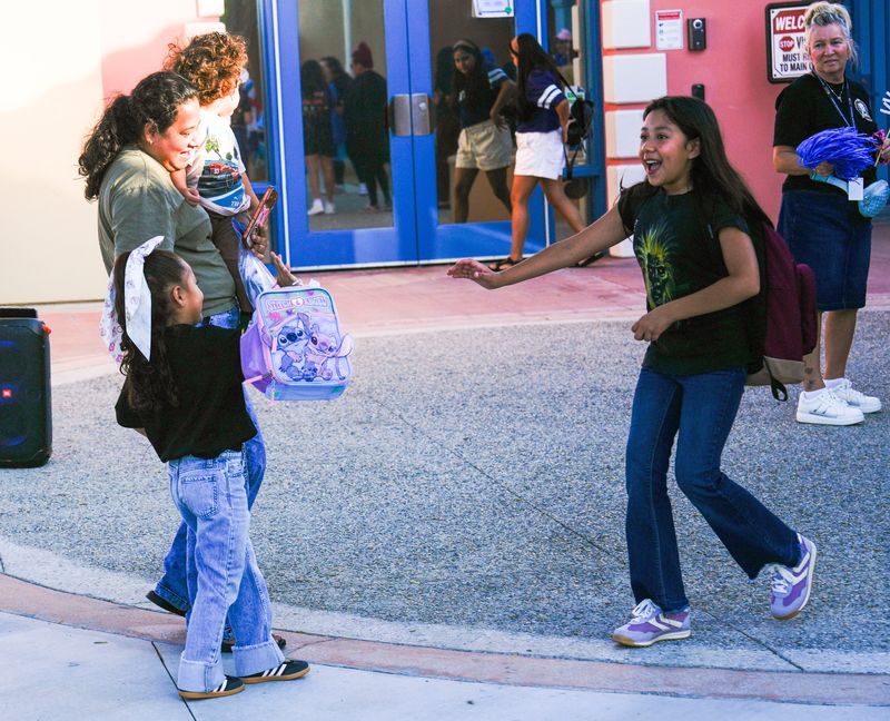 Friends reunite on the first day of the school year at Cathedral City Elementary School on Aug. 5.