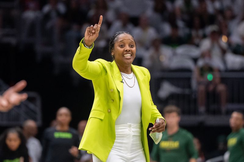 Sep 16, 2025; Seattle, Washington, USA; Seattle Storm head coach Noelle Quinn gestures to her team during the second half during game two of round one for the 2025 WNBA Playoffs against the Las Vegas Aces at Climate Pledge Arena. Mandatory Credit: Stephen Brashear-Imagn Images