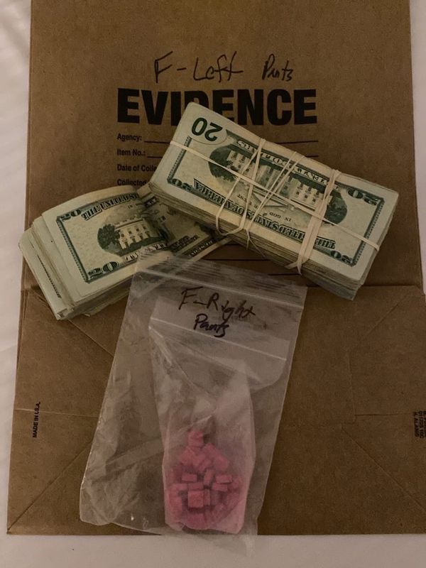 Bundles of cash and pills are displayed in a photo released by the Reno Police Department following the Wednesday, July 29, 2026, arrest of a Stockton resident during a months-long fentanyl trafficking investigation in Reno, Nev. Police said the investigation led to the seizure of more than a pound of fentanyl.