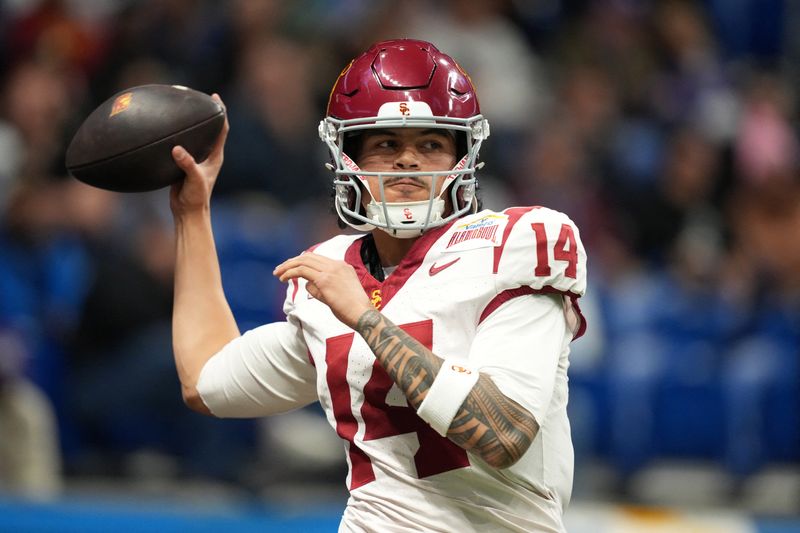 Dec 30, 2025; San Antonio, TX, USA; Southern California Trojans quarterback Jayden Maiava (14) throws the ball against the TCU Horned Frogs in the first half during the Alamo Bowl at Alamodome. Mandatory Credit: Kirby Lee-Imagn Images