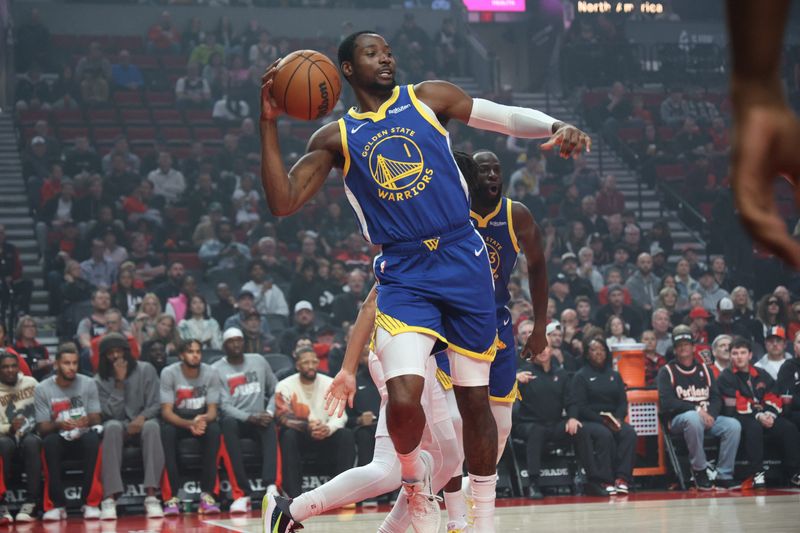 Oct 24, 2025; Portland, Oregon, USA;  Golden State Warriors forward Jonathan Kuminga (1) passes the ball against the Portland Trail Blazers in the first half at Moda Center. Mandatory Credit: Jaime Valdez-Imagn Images
