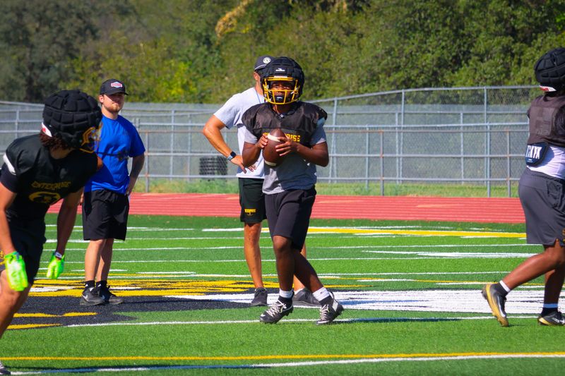 Enterprise senior Izaiah Mikell leads offensive drills for the Hornets in practice on Tuesday, Aug. 4, 2026. Mikell is set to be one of the best dual threat quarterbacks in the section heading into the new season.