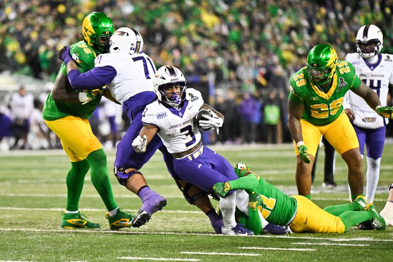 Dec 20, 2025; Eugene, OR, USA; James Madison Dukes running back Wayne Knight (3) rushes during the third quarter against the Oregon Ducks at Autzen Stadium. Mandatory Credit: Craig Strobeck-Imagn Images